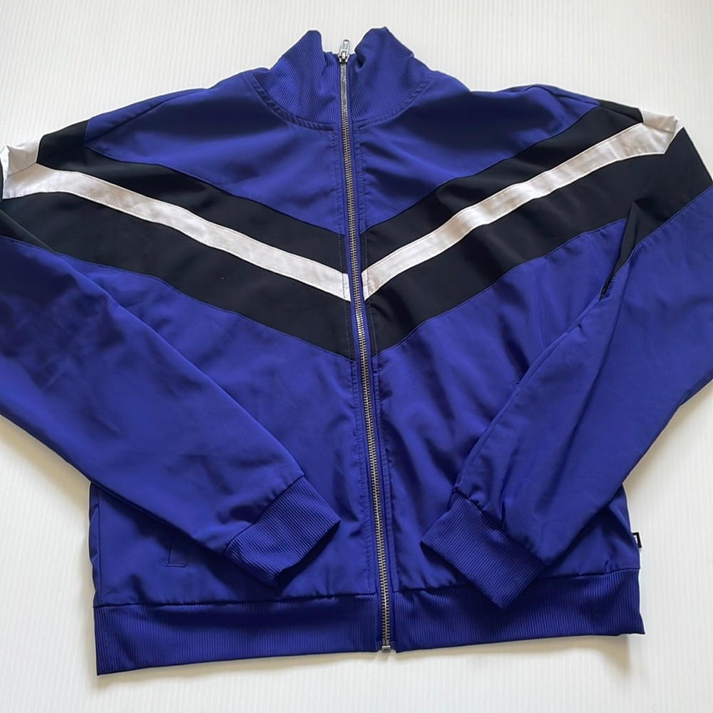Fabletics purple-blue track jacket with black & white striping. Women’s medium